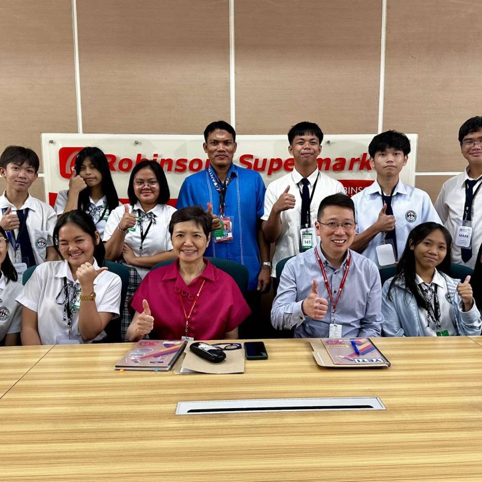 During The Boardroom shoot, Robina Gokongwei, President and CEO of Robinsons Retail Holdings, and Chief Operating Officer Stanley Co were joined by students from Santolan High School.