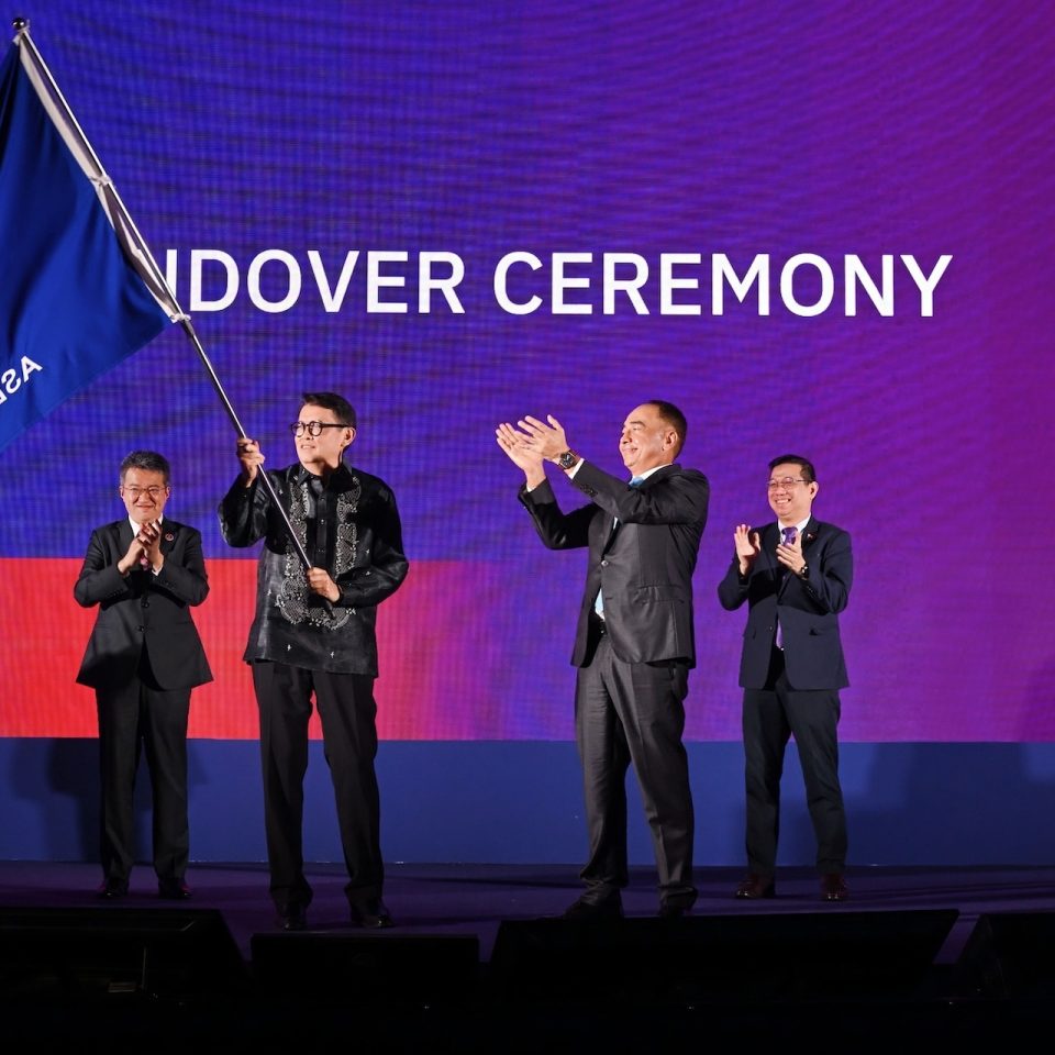 ASEAN-BAC 2026 chair Jose Ma. "Joey" Concepcion III raises the flag as he accepts the chairship from ASEAN-BAC Malaysia's Tan Sri Nazir Razak during the handover ceremony at the closing of the ASEAN Business and Investment Summit last October 26, 2025 in Kuala Lumpur, Malaysia. Looking on are Hon. Liew Chin Tong, Deputy Minister of Investment, Trade and Industry of Malaysia (leftmost) and Hon. Cetenno Rodolfo, Undersecretary of the Industry Development and Investment Promotion Group of the Department of Trade and Industry of the Philippines (rightmost).